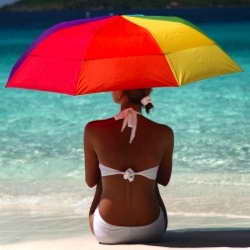 woman on beach with umbrella