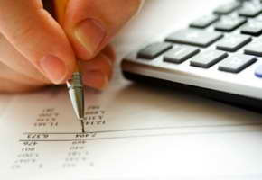 pen, calculator, and finances